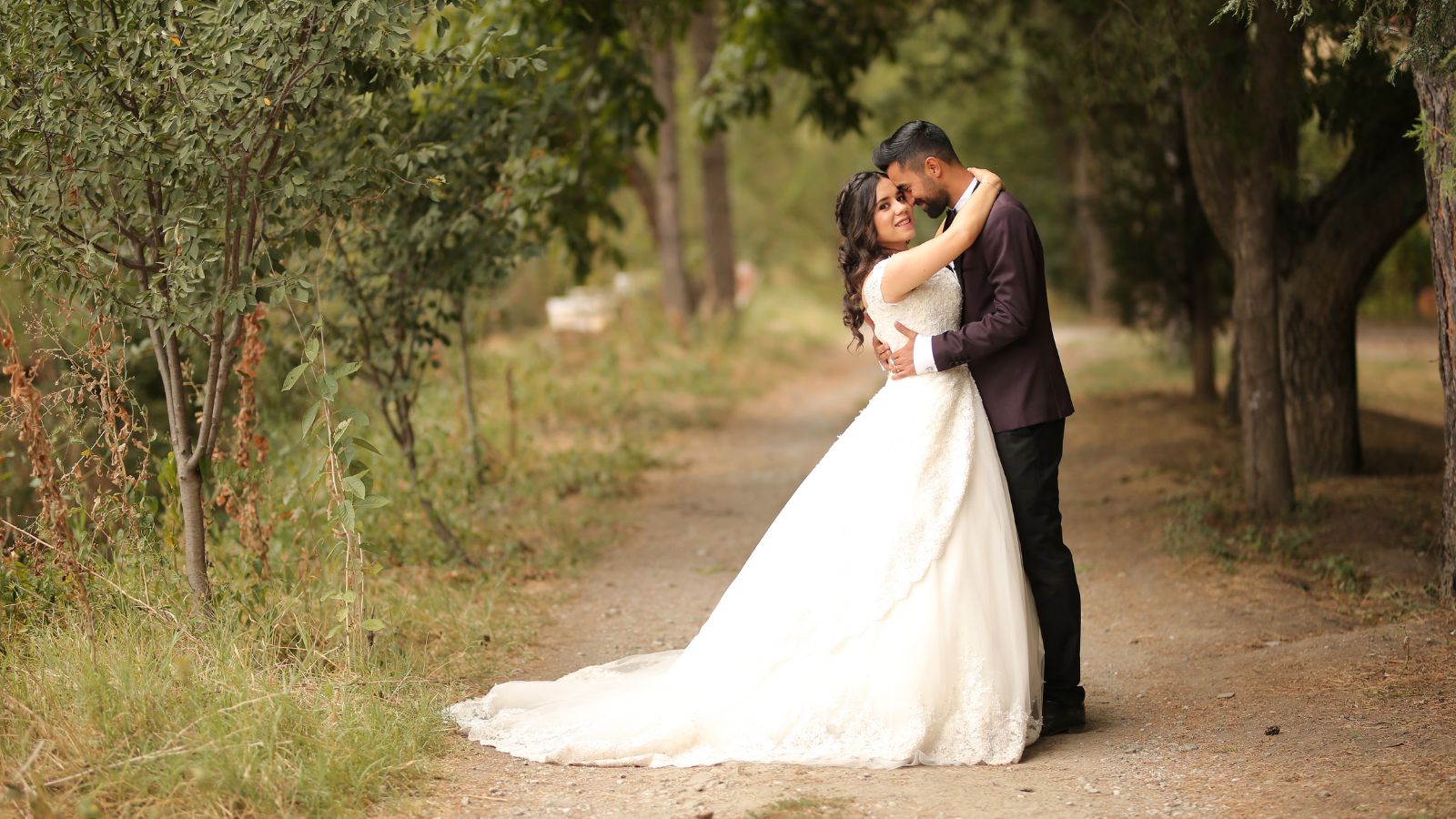 The bride and the groom kissing