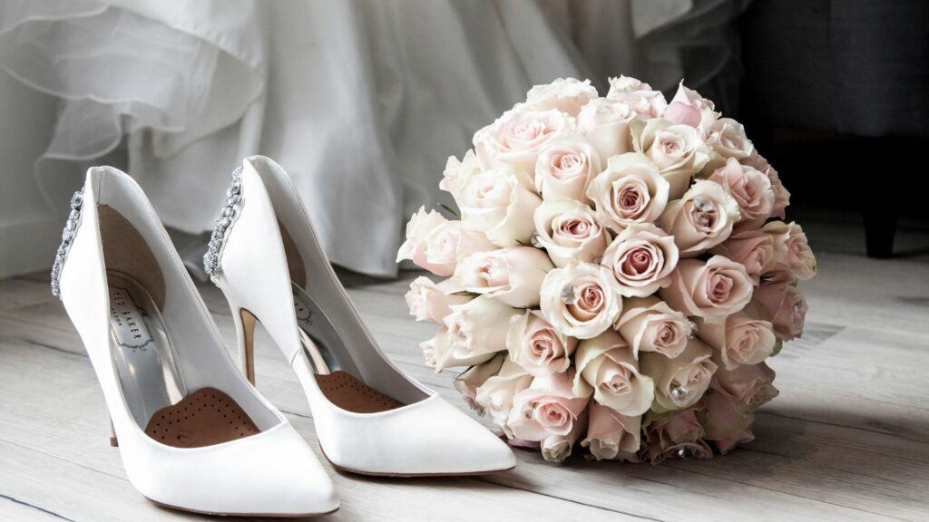A white shoes and a wedding flower.