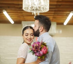 Couple under Chandelier in Las Vegas Wedding Chapel