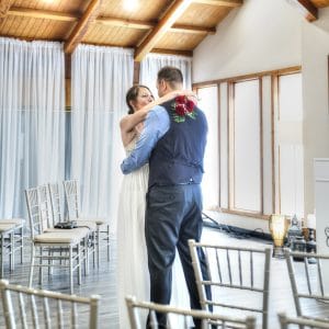 Wedding couple dancing inside chapel
