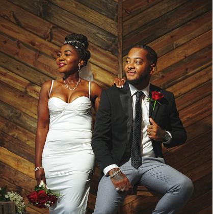 a photograph of stunning bride and groom with a wooden background