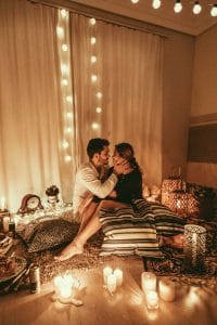 Couple on an at home candle picnic date in Vegas