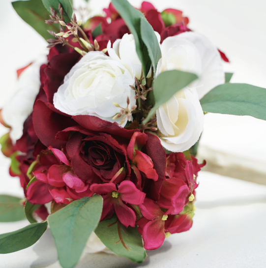 Red and white flowers arranged as a pretty and simple bouquet