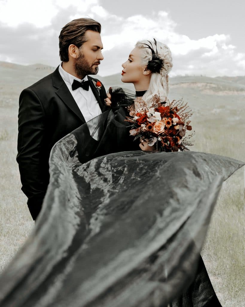 Married Couple in Black in a Field at The Little Vegas Chapel Wedding